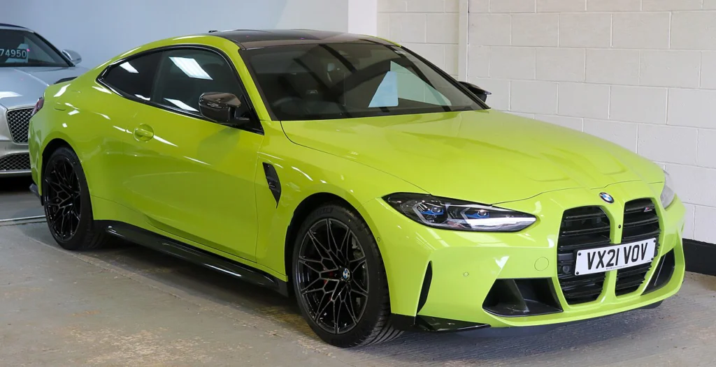 Yellow-green BMW M4 Competition coupe