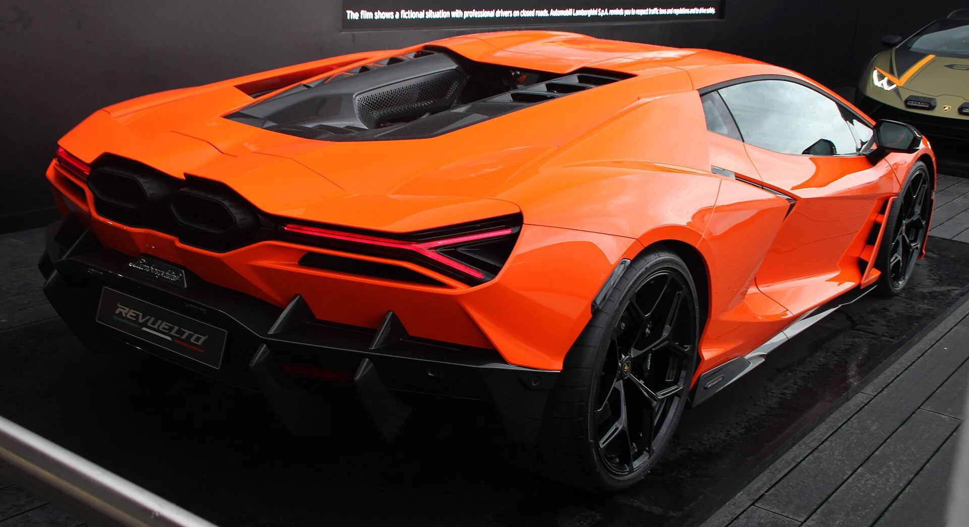 Rear view of an orange Lamborghini Revuelto