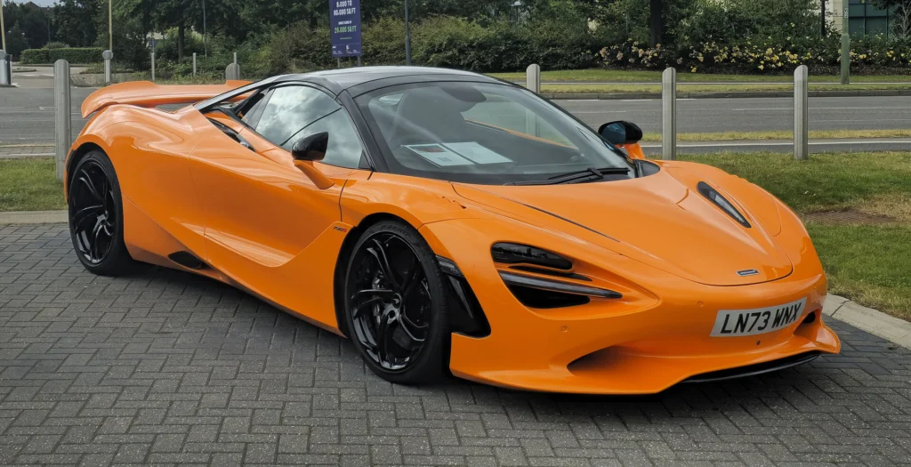 Orange McLaren 750S parked beside a road