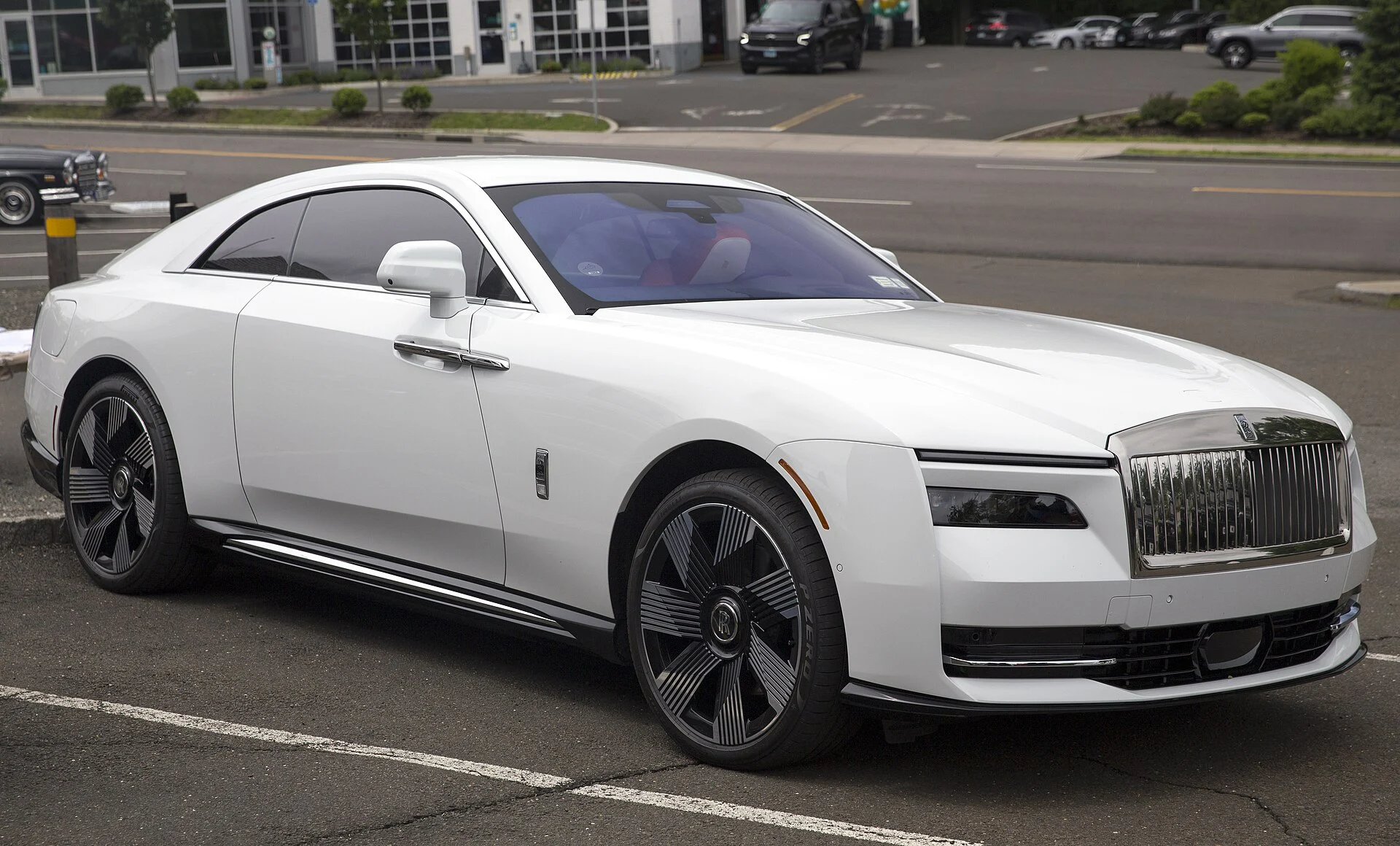 White Rolls-Royce Spectre coupe, front three-quarter view