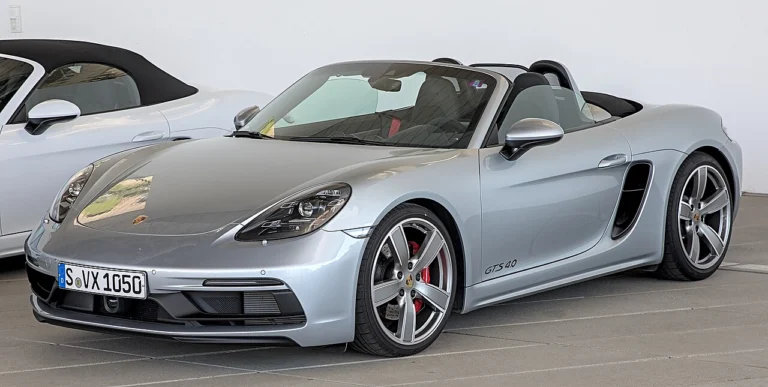 Silver Porsche 718 Boxster GTS 4.0 with its roof lowered
