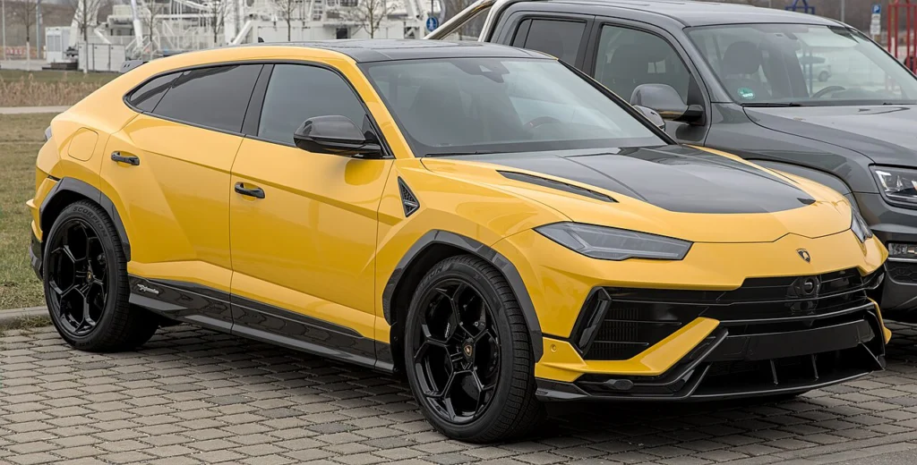 Yellow Lamborghini Urus Performante with a black hood
