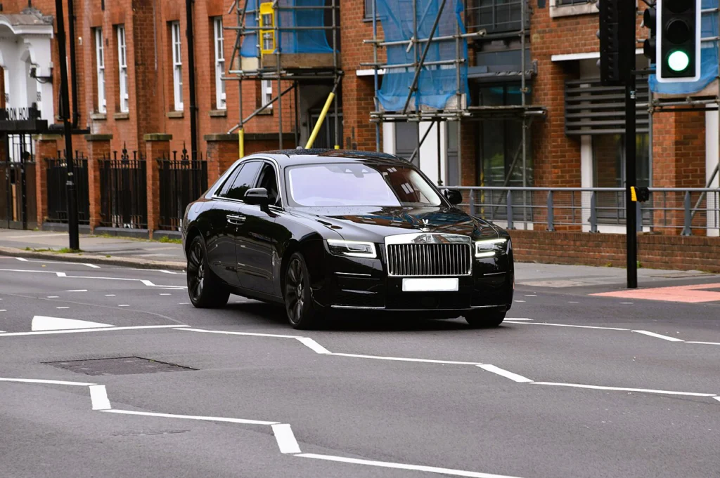 Black Rolls-Royce Ghost II sedan on a city street