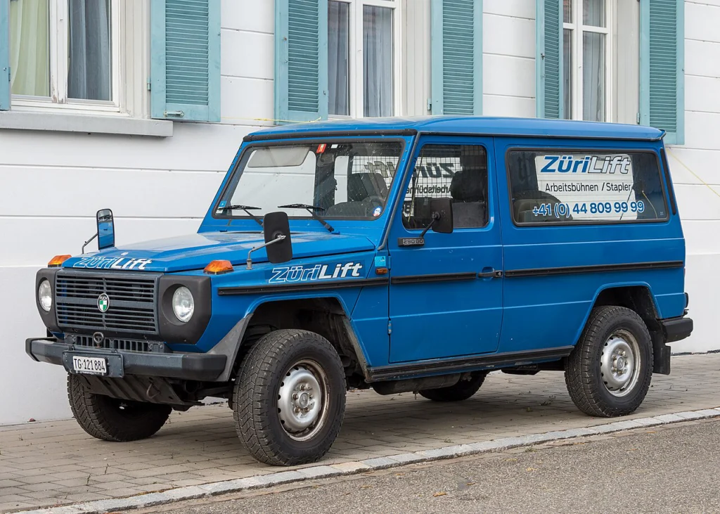 Blue Steyr-Daimler-Puch 290 GD parked on a street